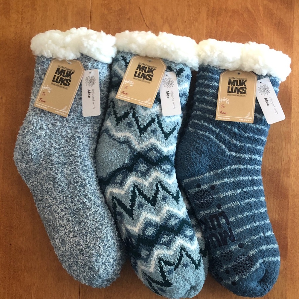 NWT. Set of 3 pairs of aloe infused, cuddly socks w/ Muk Luks logo & grippers